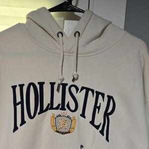 Hollister Men's Cream Hoodie with Navy Logo
